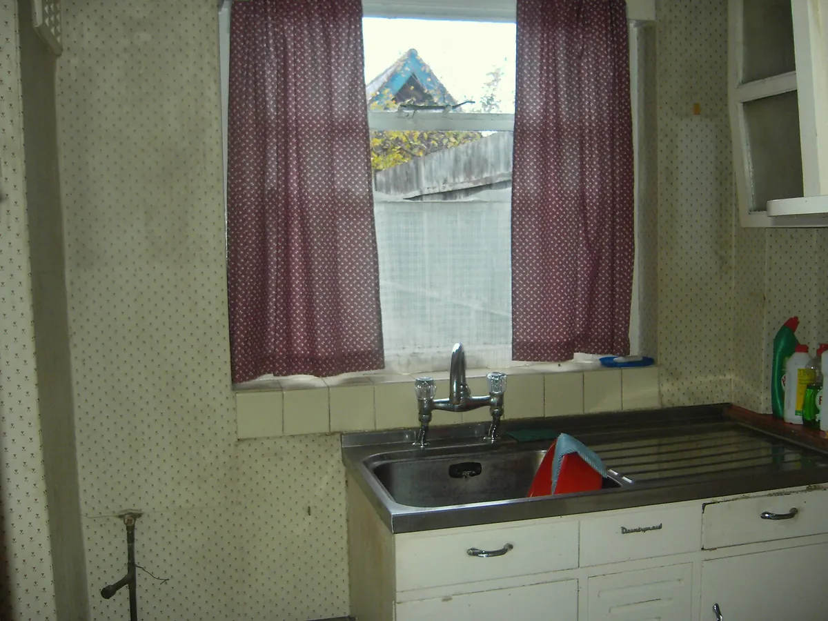 Dated kitchen in a vacant Victorian terrace before refurbishment