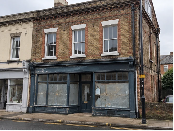 Vacant brick shopfront with residential accommodation above